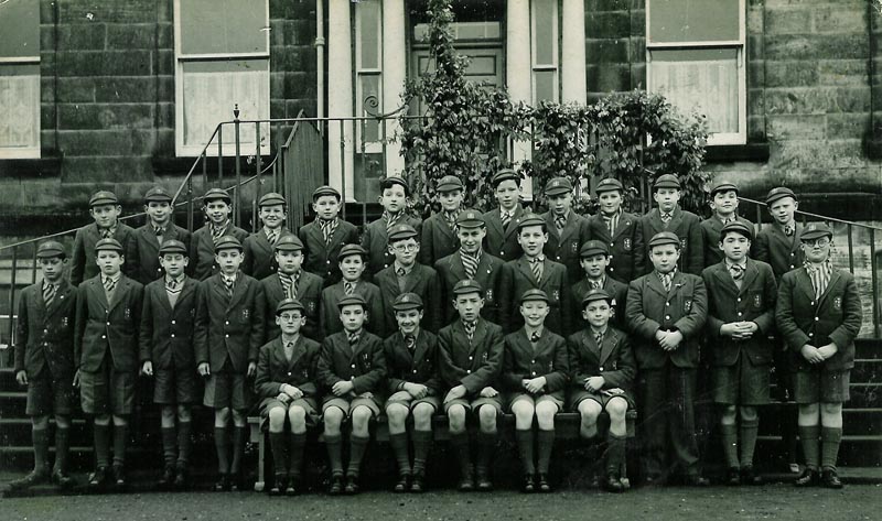 Class Photo First Year 1954.jpg - First Year 1954.Back row - 'Tubby' Gordan, Frank Malcolm, Brian MacNammara, Tony McKeen, Andy.Lonie, Michael Bergen, Joe.Barrett, 'Squeek' McGhieenie, PeterHunt, James.Murdoch, Paddy.Burke, John Neville, 'Tich', Clark, Absent Michael MacNamara, Additions Mike Ashley, Jack.MacLaughlin, John.Martin,(Paul's brther who came from the Holy ghost Fathers)Middle Row- Danny Lamberty, Chris Barry, John McKenna, 'Steve' McDonald, Billy. Gillon, Desi Macinally, David.Wright, tom.Flynn, Robert.Donelly, Michael.Gillard, Paul.Martin, Malcolm.Tunmore, Terry.Eagle.Sitting- D. Marshall, Jacky.Broadley, B.McLeann, Jimmy Hunt, Leo Cummings, Bruce Laidlaw.